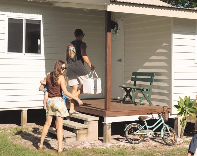 A family of four arriving at Coastal & Co. cottage.
